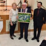 Stewart Halliday Receives "Eugenia Falls" 2018 as a gift. The painting was purchased by Grey Highlands. (with Mayor McQueen and Councillor Silverton)